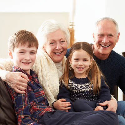 Grandparents and two grandchildren smiling