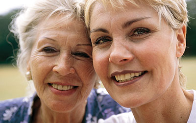 Two women smiling.