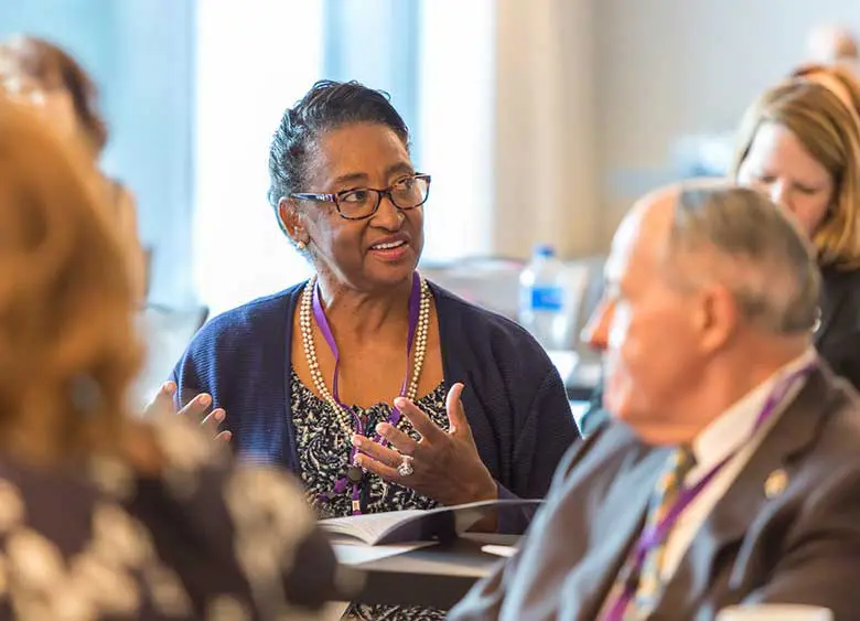 Woman talking with others