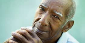 Close up of man clasping hands togther