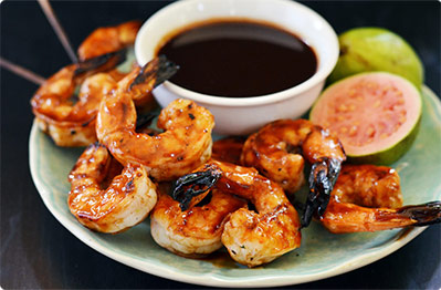 Chef Andrew Zimmern's Grilled Shrimp with Coconut Rice and Rum Glaze.